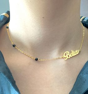 NECKLACE WITH ONYX STONES AND WORD "BELIEVE"